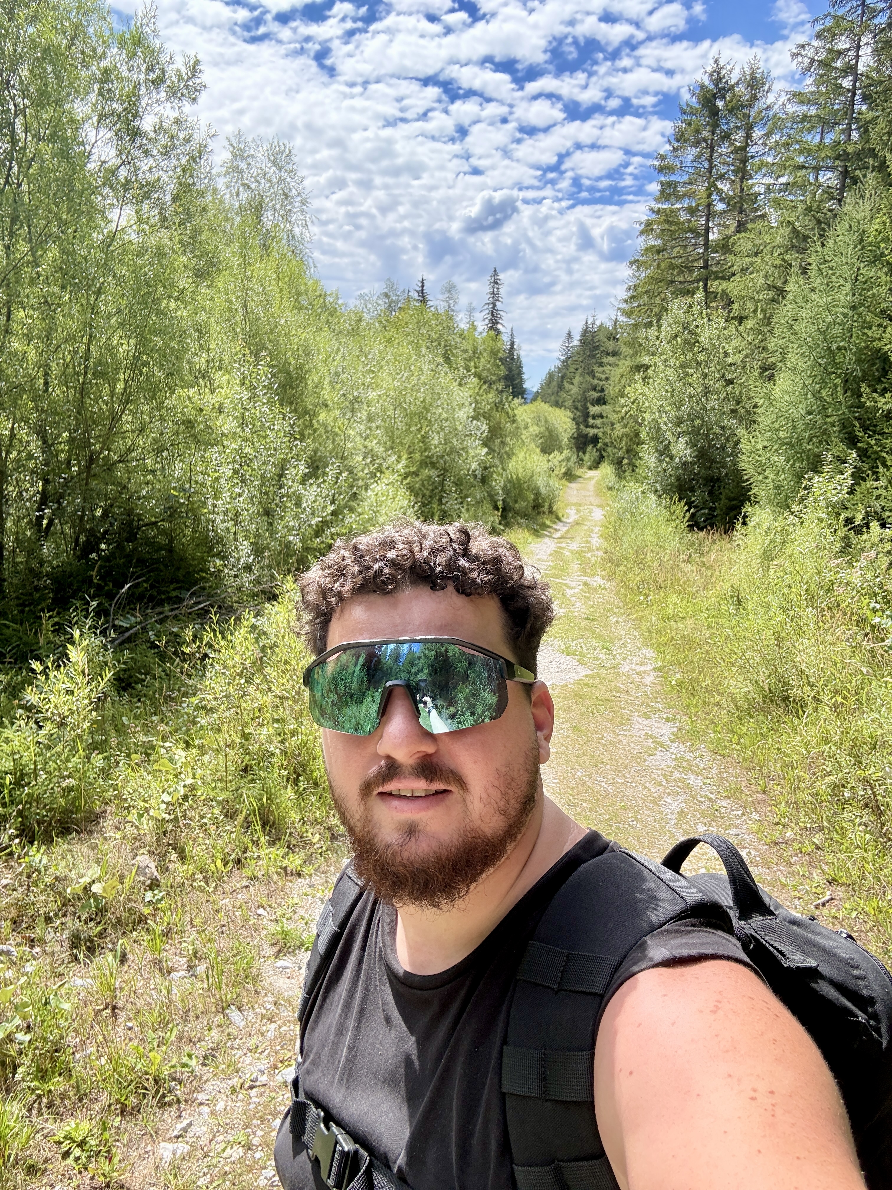 A hiker standing above a mountain valley